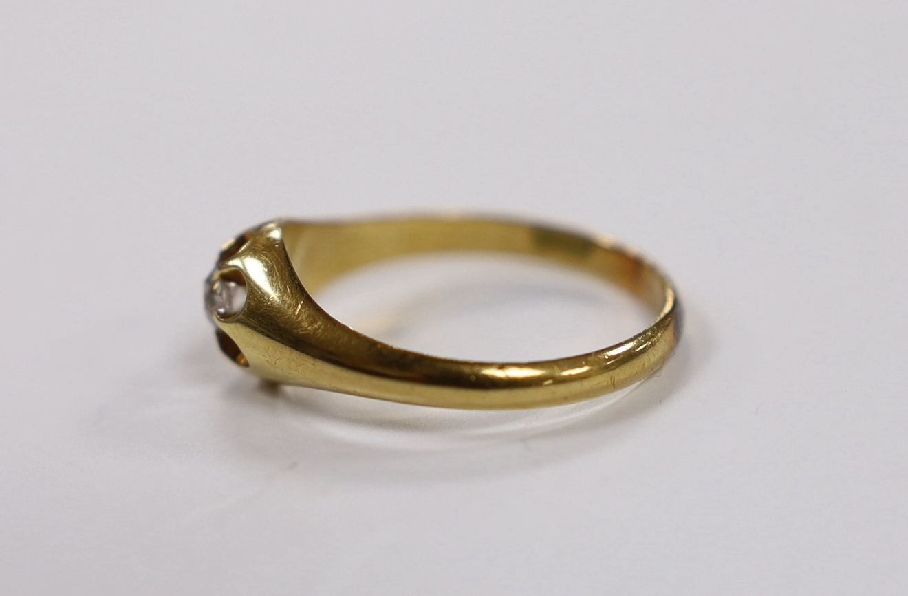 A late Victorian 18ct gold and claw set solitaire diamond ring, size U, gross weight 4.7 grams.